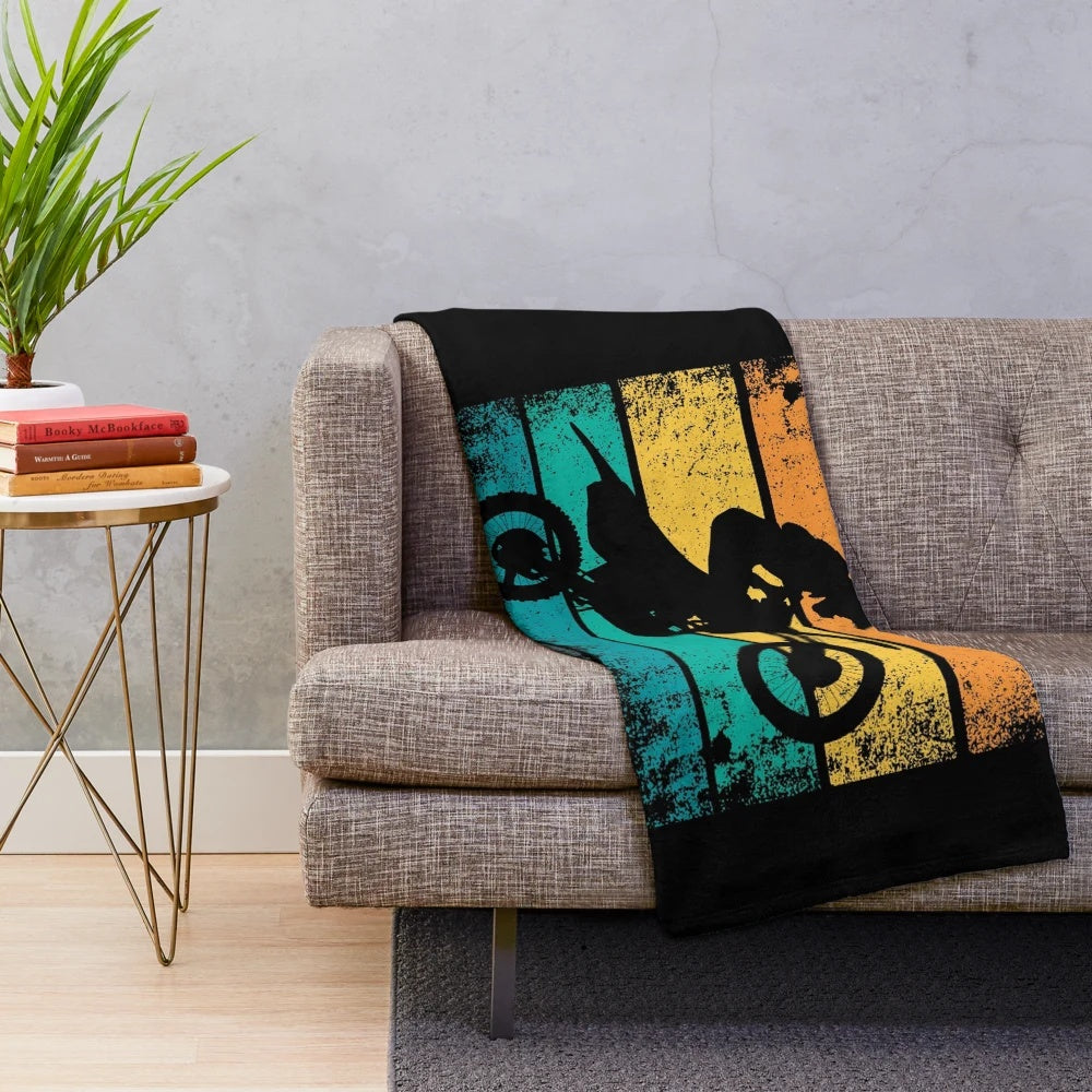 Retro motocross-themed plush blanket with distressed sunset design