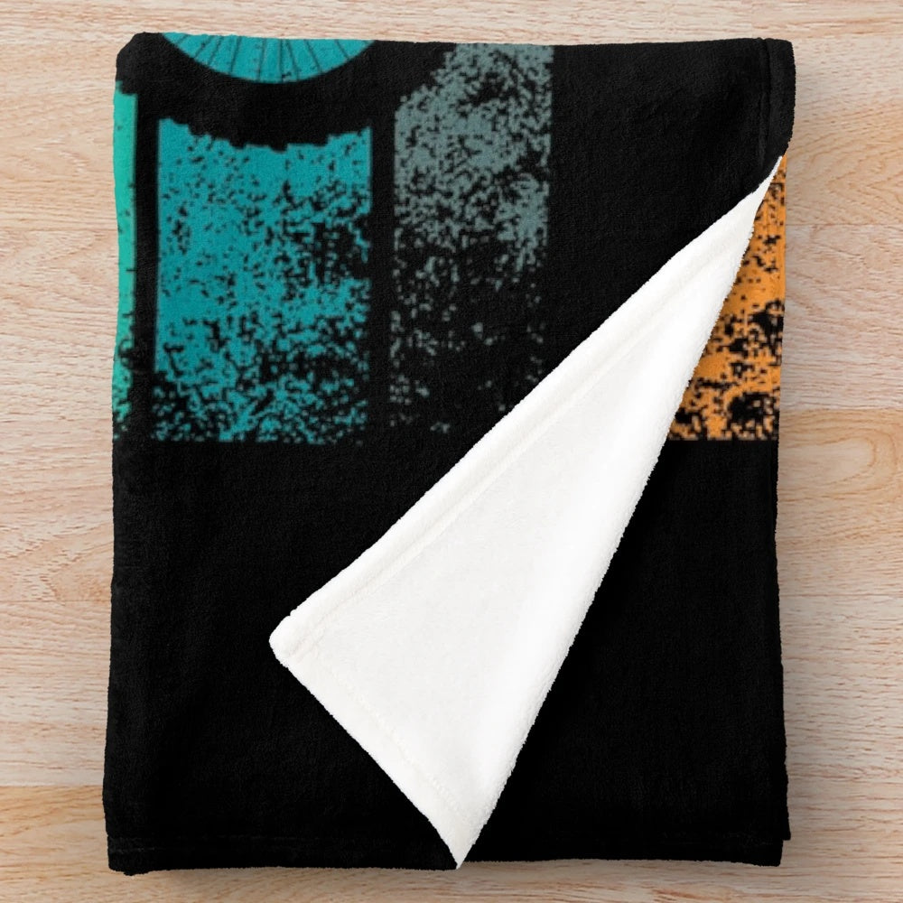 Retro motocross-themed plush blanket with distressed sunset design