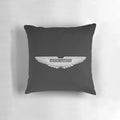 Aston Martin logo on a black carbon fiber background printed on a throw pillow