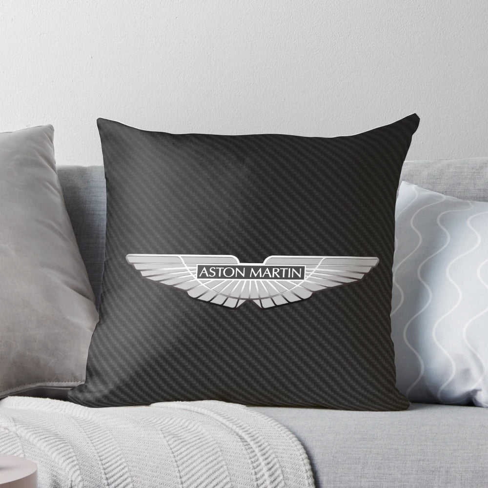 Aston Martin logo on a black carbon fiber background printed on a throw pillow