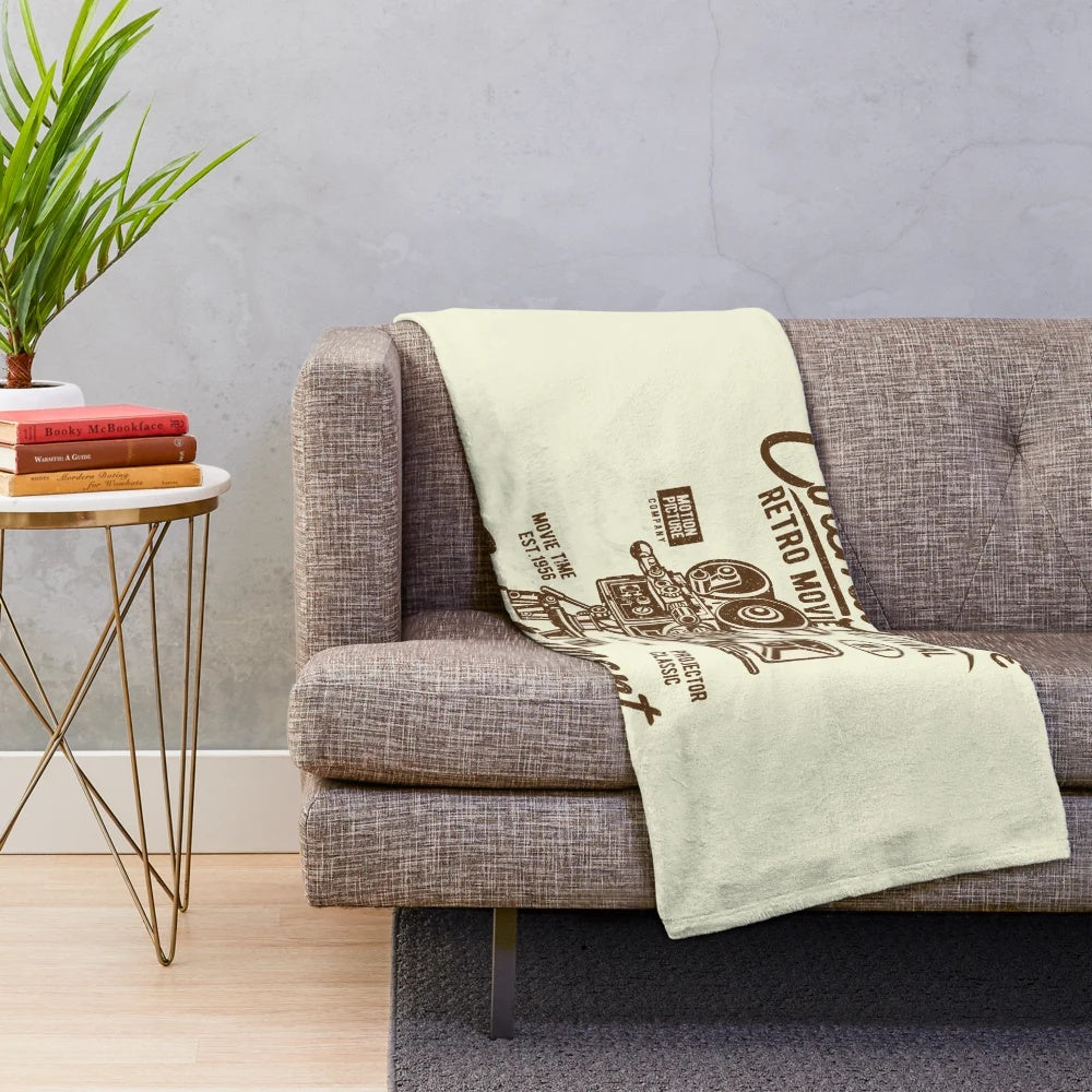 Retro movie-themed plush blanket with classic cinema motifs