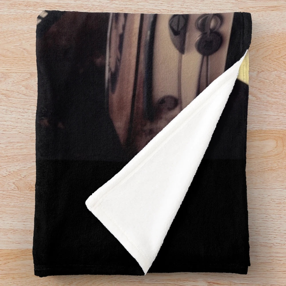 Plush blanket with a retro movie design, evoking the golden age of cinema