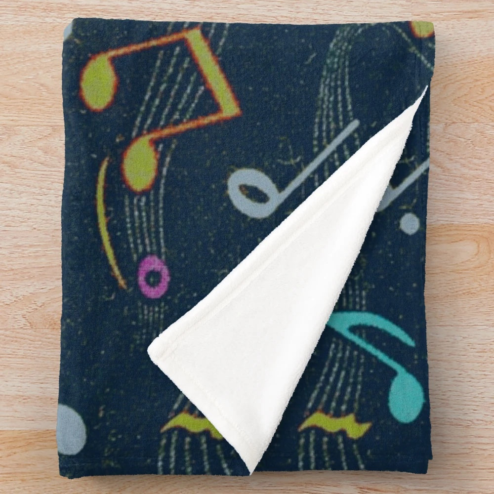 Colorful vintage-style plush blanket with retro musical notes pattern