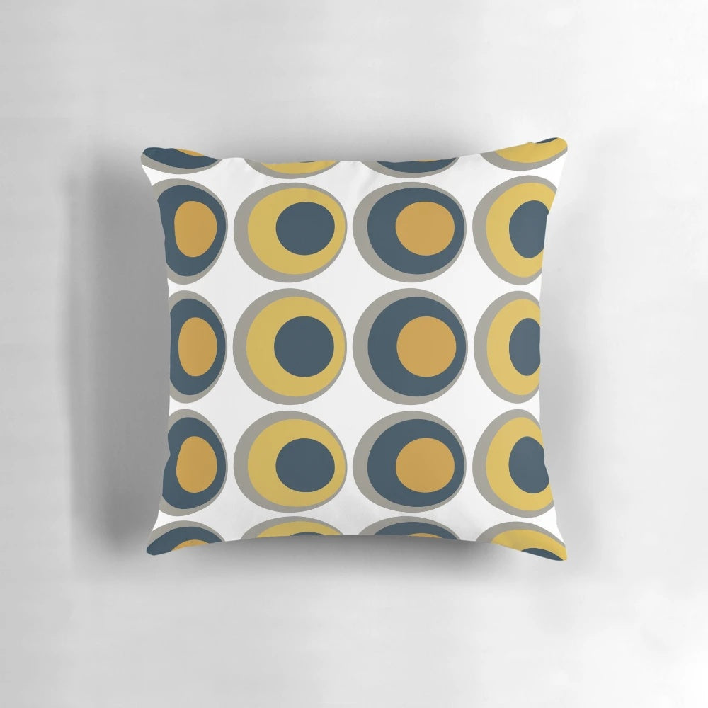 Retro-inspired mustard yellow, navy, grey, and white geometric pattern pillow