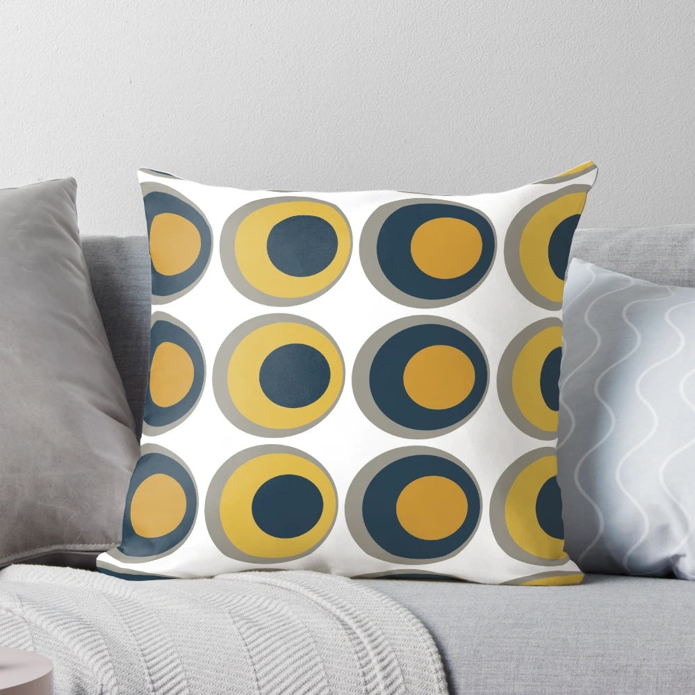 Retro-inspired mustard yellow, navy, grey, and white geometric pattern pillow