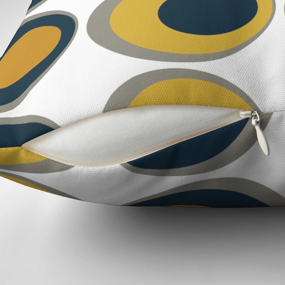 Retro-inspired mustard yellow, navy, grey, and white geometric pattern pillow
