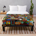 Vintage-style plush blanket featuring a collage of national park travel decals