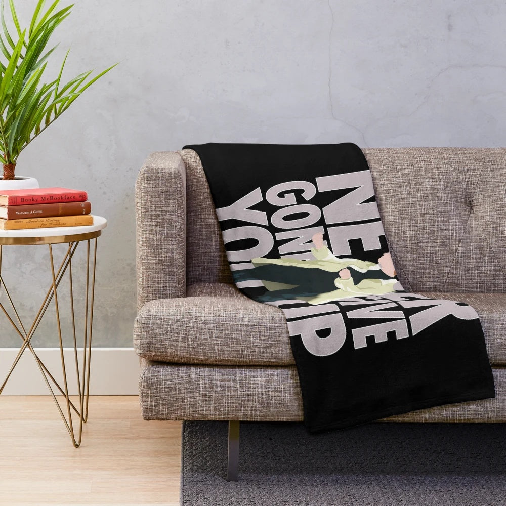 Plush blanket featuring Rick Astley's iconic "Never Gonna Give You Up" design