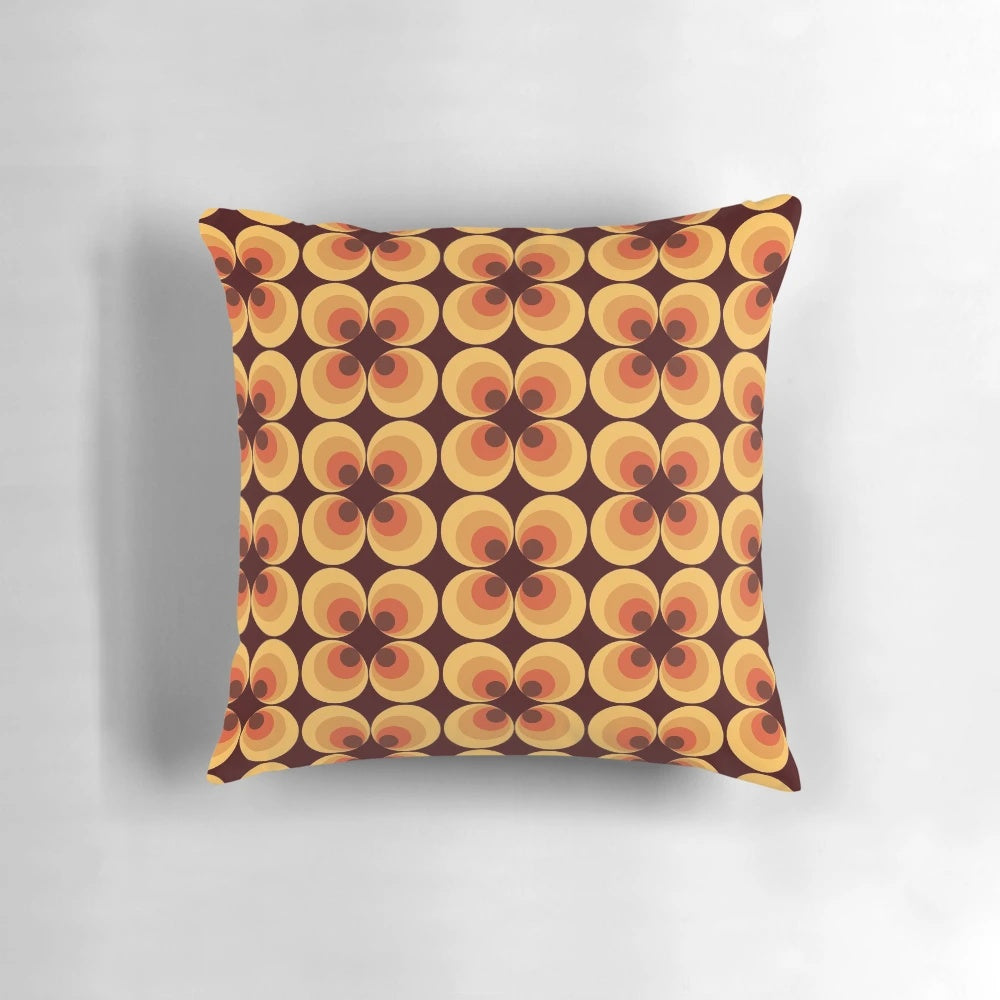 Retro orange 70s inspired pillow with a fun, vintage circle pattern