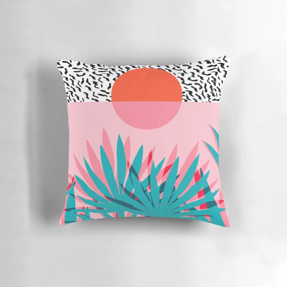 Retro palm tree and sunrise design on a throw pillow, perfect for 1980s-inspired beach resort decor.