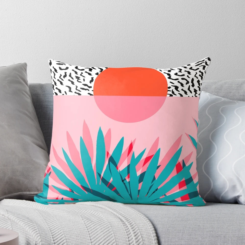 Retro palm tree and sunrise design on a throw pillow, perfect for 1980s-inspired beach resort decor.