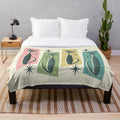 Retro patchwork plush blanket featuring geometric cat and starburst designs