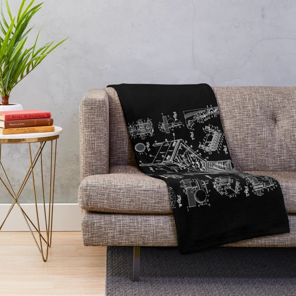 Cozy plush blanket featuring a vintage pinball machine patent design