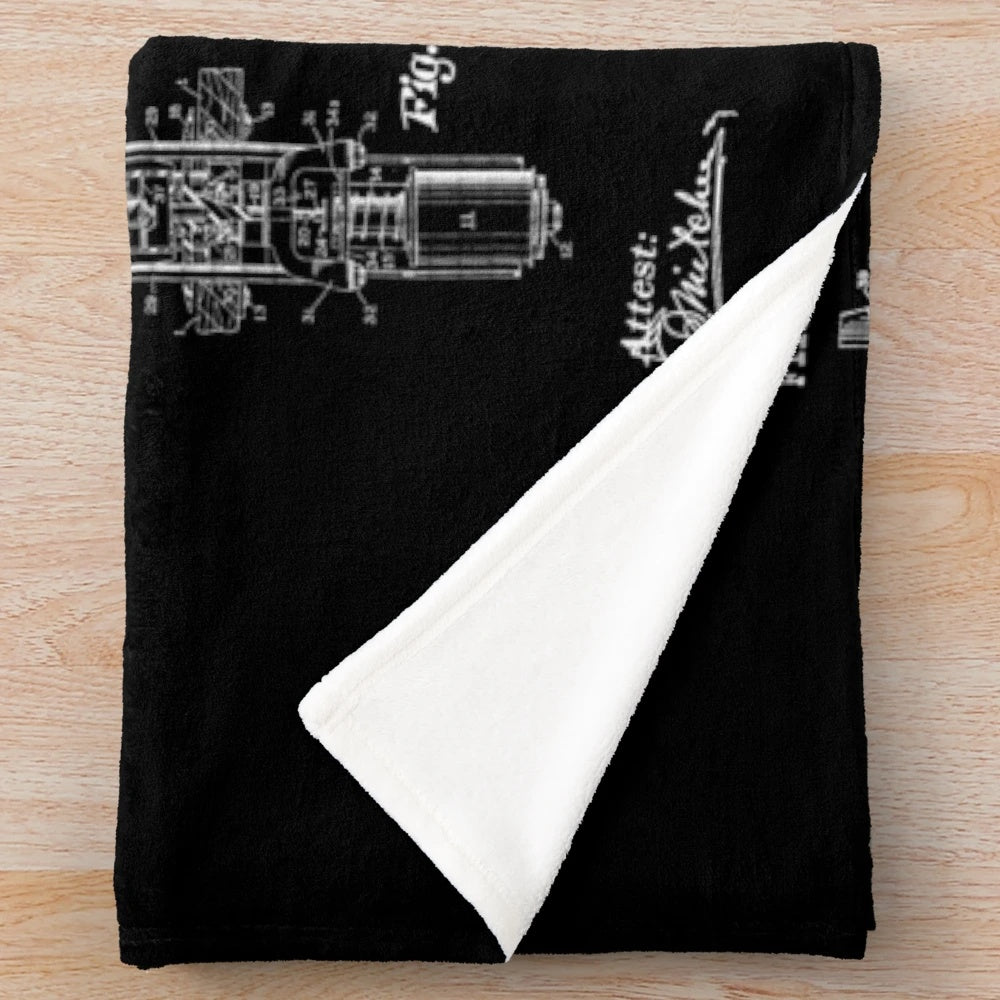 Cozy plush blanket featuring a vintage pinball machine patent design