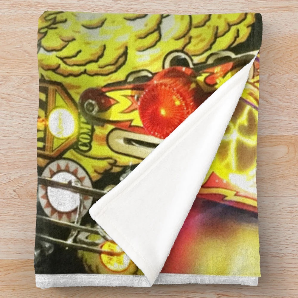 Plush blanket featuring a classic pinball machine design