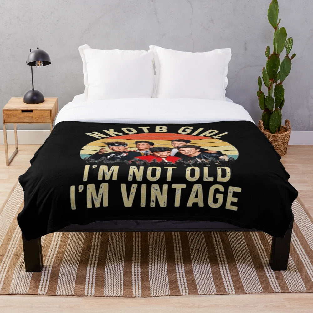 Retro plush blanket with NKOTB design for fans