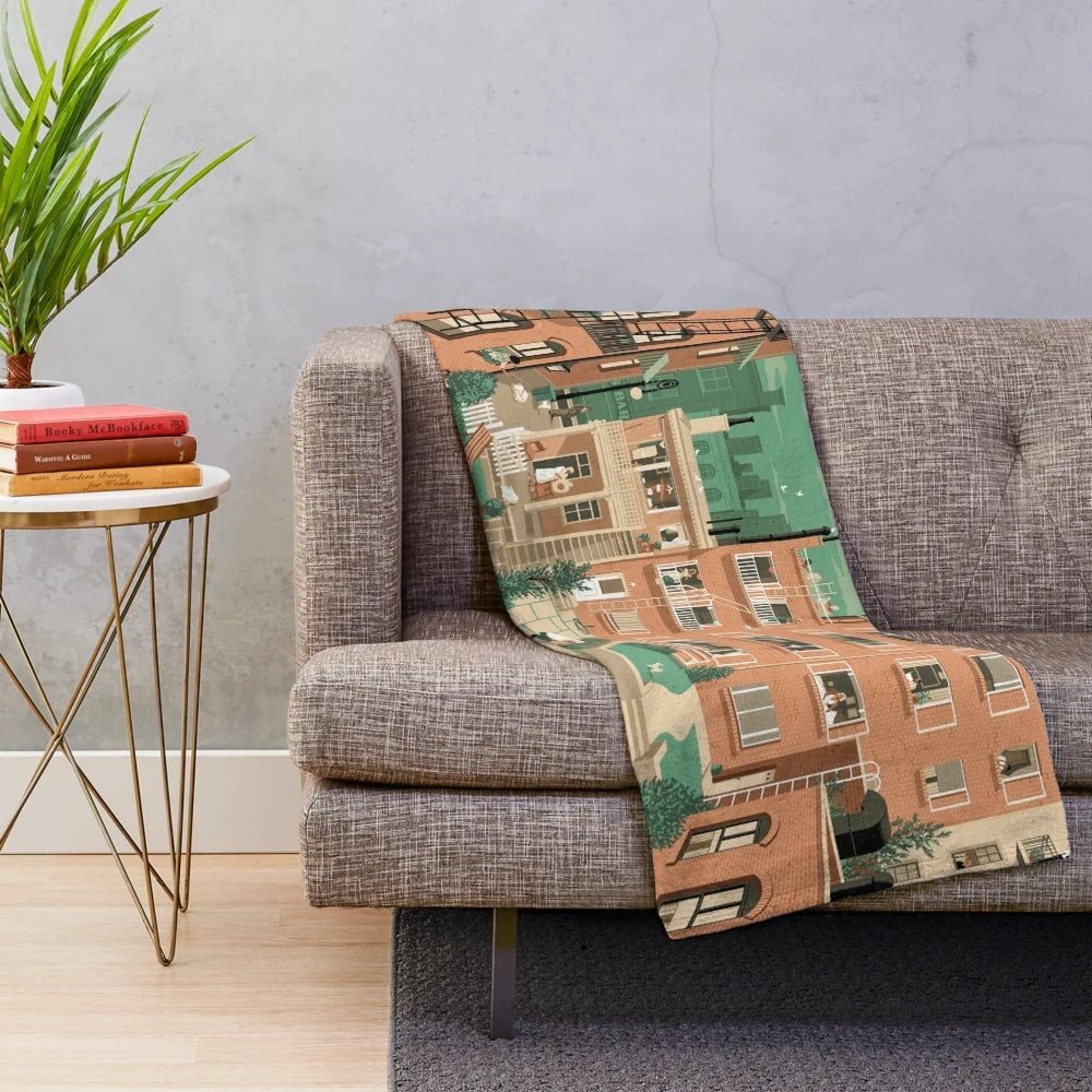 Vintage-style plush blanket featuring the cityscape from Alfred Hitchcock's classic film Rear Window