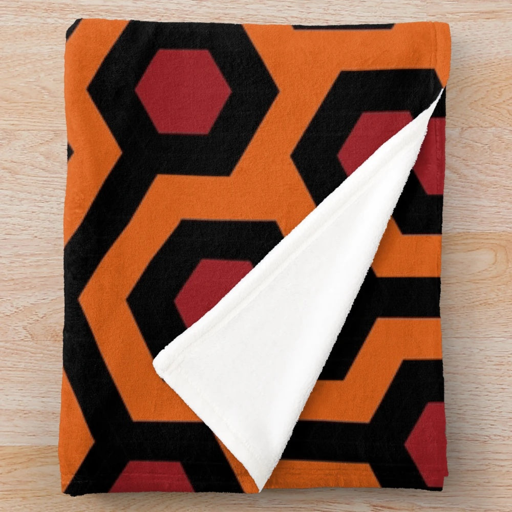 Plush blanket with geometric abstract overlook hotel carpet pattern