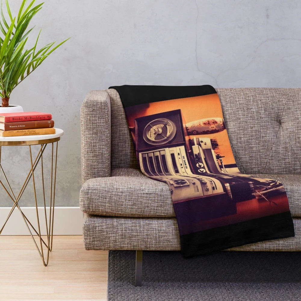 Retro-style plush blanket featuring classic movie motifs