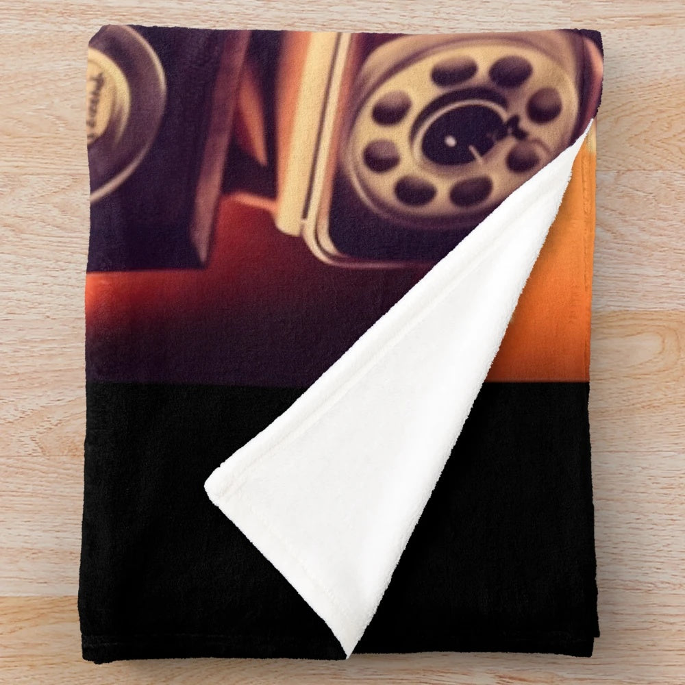Retro-style plush blanket featuring classic movie motifs