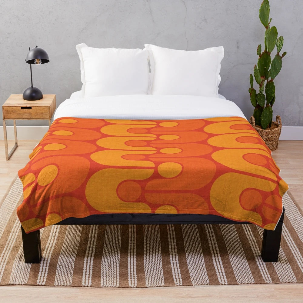 Vintage-inspired plush blanket with a vibrant, retro-modern pattern