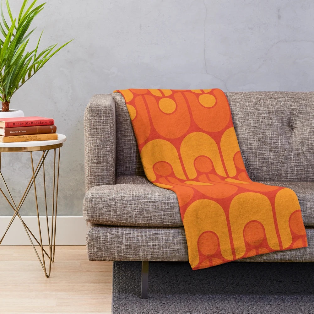 Vintage-inspired plush blanket with a vibrant, retro-modern pattern