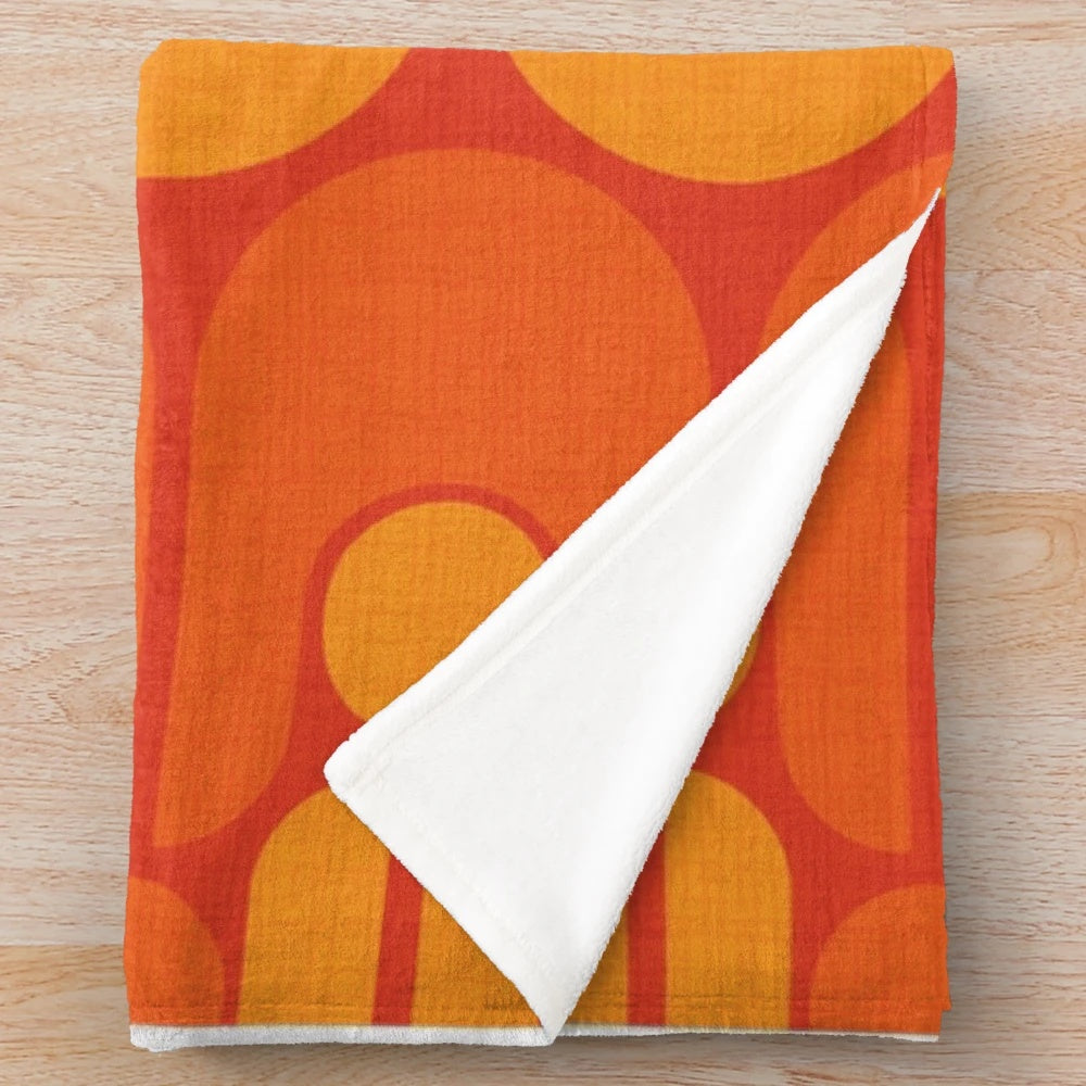 Vintage-inspired plush blanket with a vibrant, retro-modern pattern