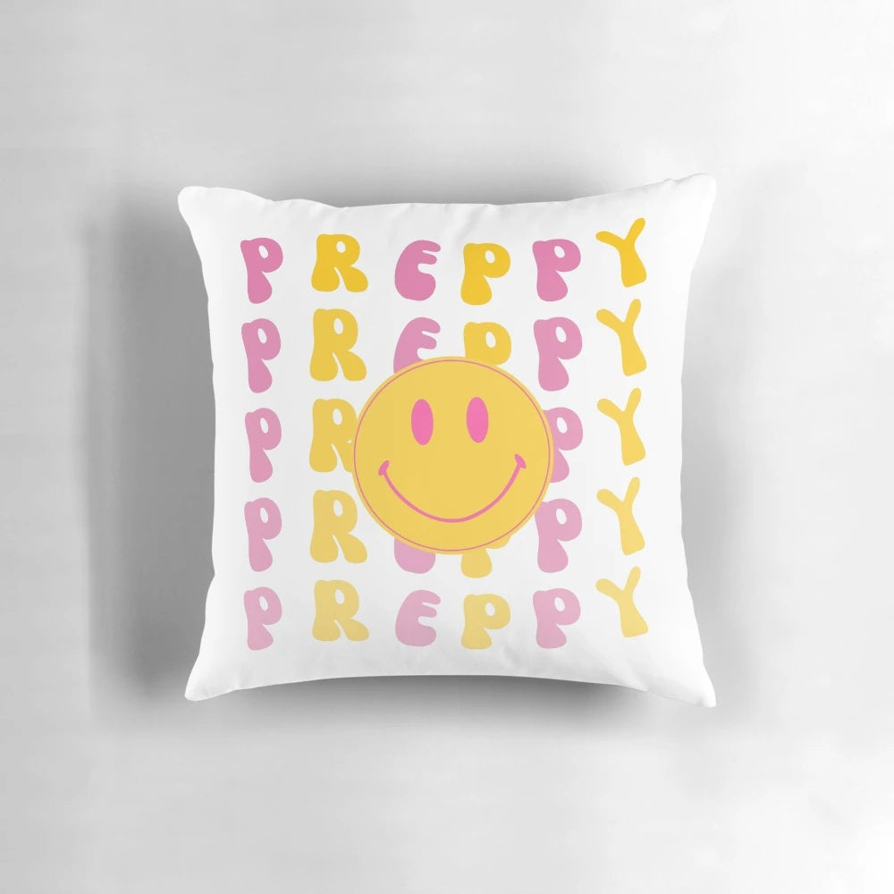 Vibrant yellow and pink preppy smiley face pillow with wavy retro text