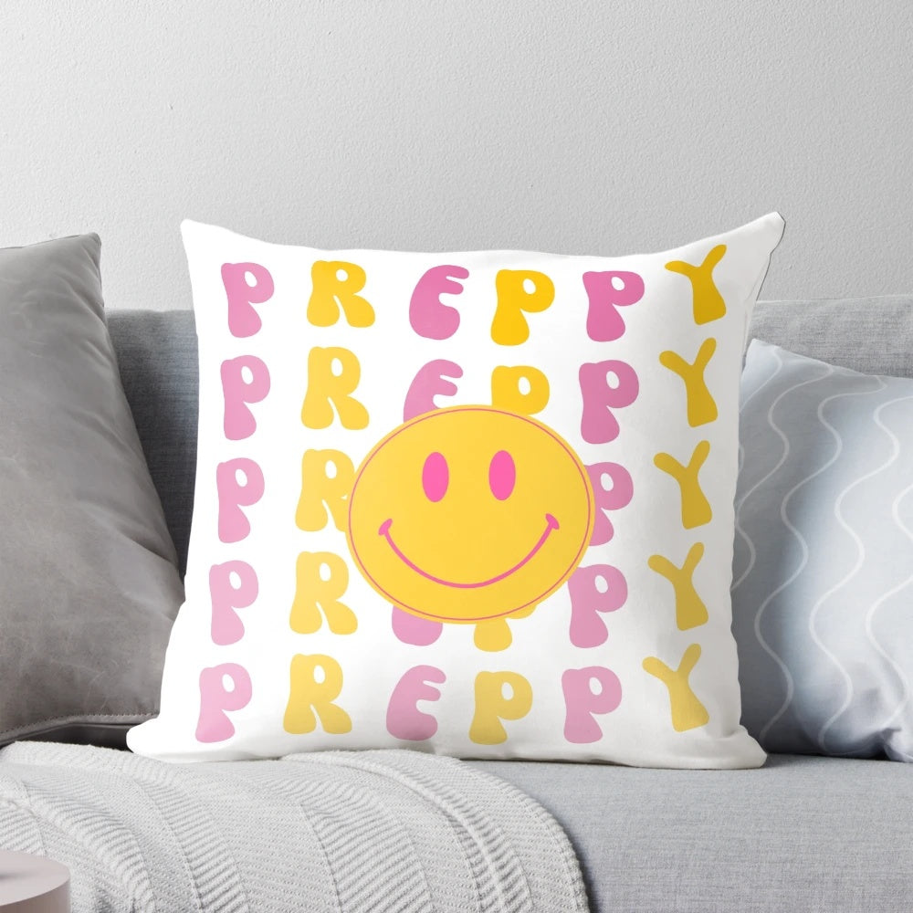 Vibrant yellow and pink preppy smiley face pillow with wavy retro text