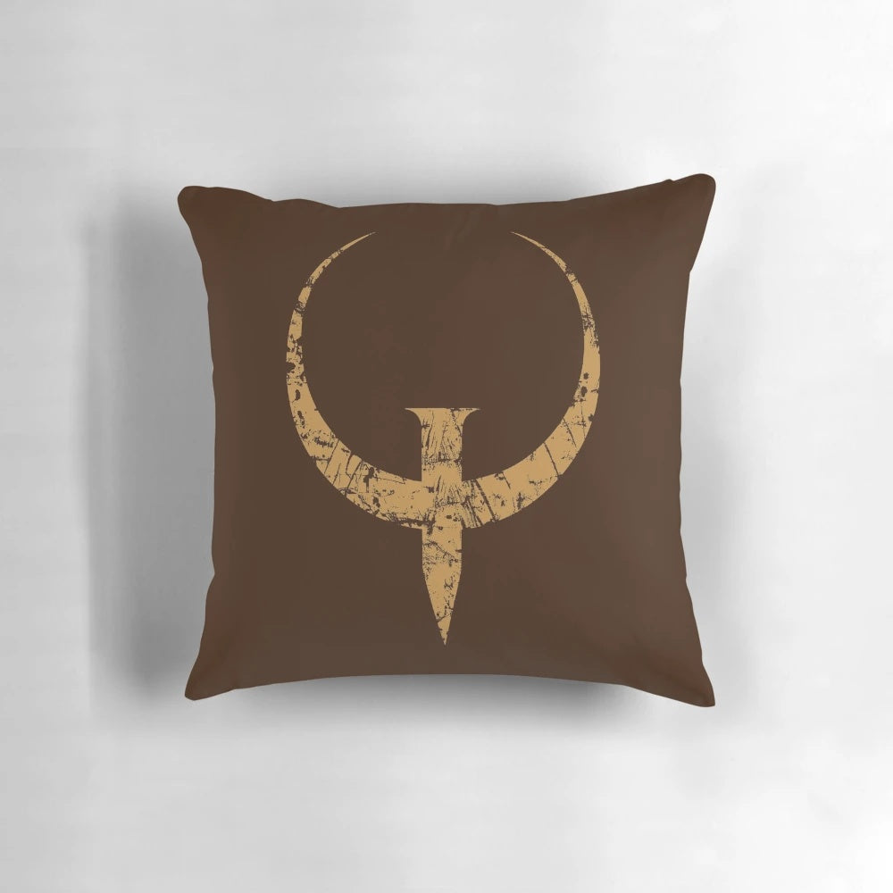 Bronze-colored Quake logo pillow, featuring the iconic FPS game design