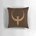 Bronze-colored Quake logo pillow, featuring the iconic FPS game design