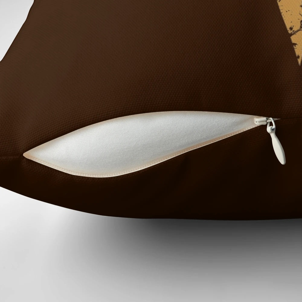 Bronze-colored Quake logo pillow, featuring the iconic FPS game design