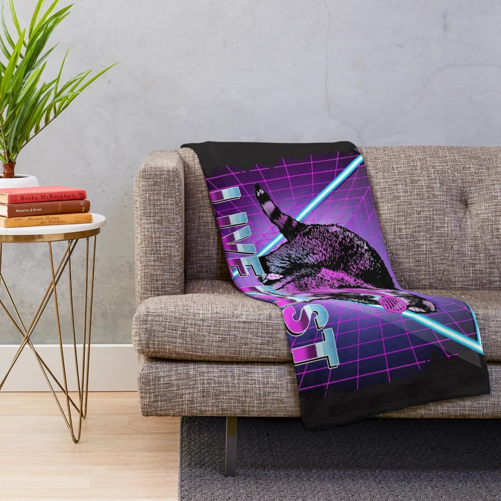 Retro-inspired raccoon plush blanket with "Live Fast Eat Trash" design