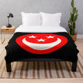 Cozy red plush blanket with smiley face design