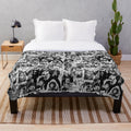 Retro rock and roll plush blanket featuring a collage of iconic music artists and symbols