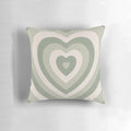 Sage green heart-shaped pillow with a vintage, aesthetic design