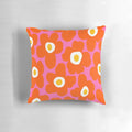 Retro Scandinavian-inspired floral pattern pillow in vibrant pink and orange colors