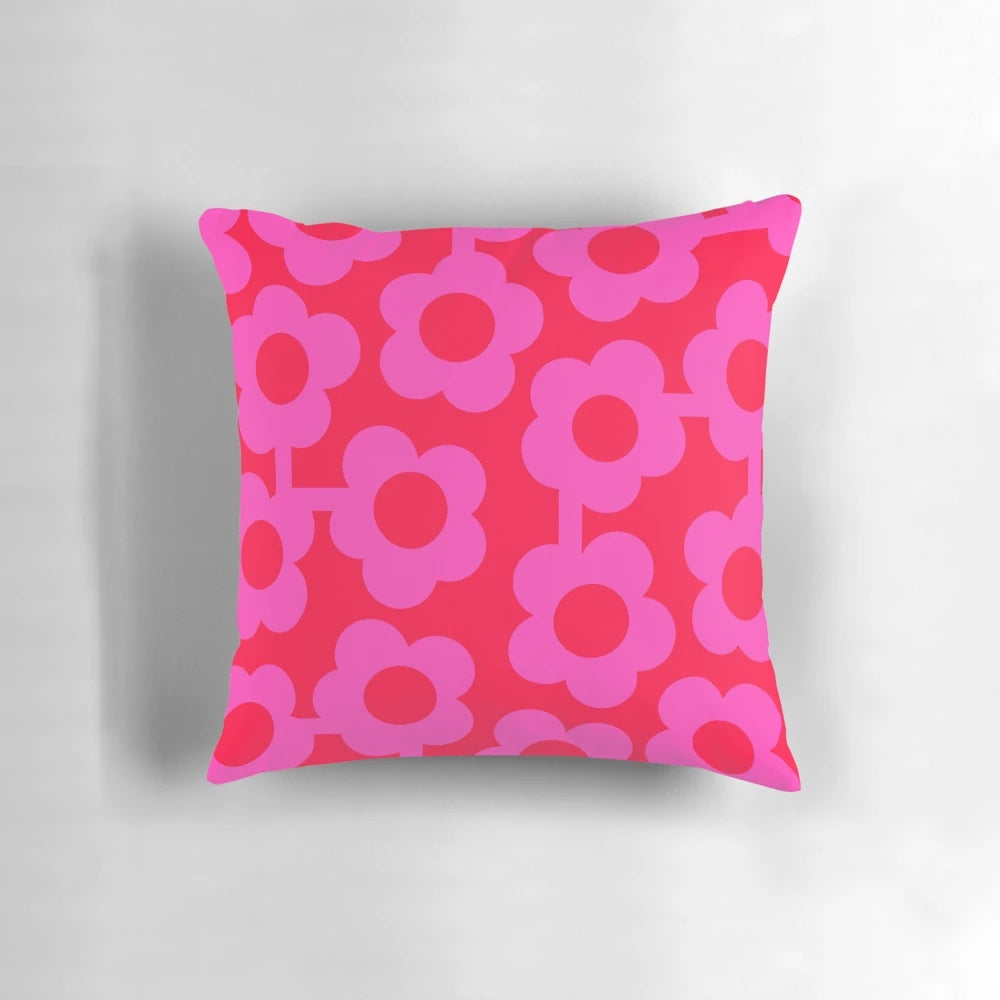 Vibrant Scandinavian-inspired floral pillow in shades of pink and neon red