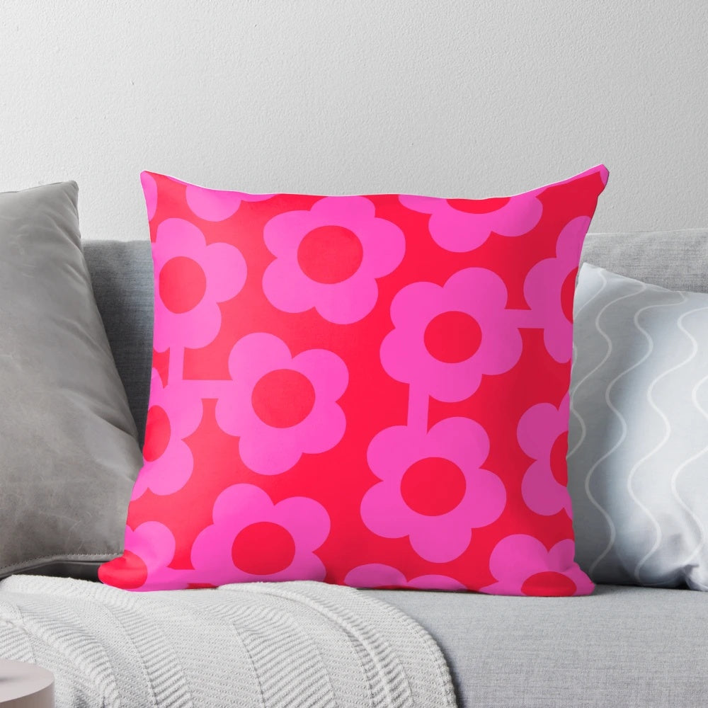 Vibrant Scandinavian-inspired floral pillow in shades of pink and neon red