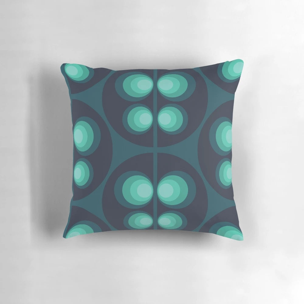 Retro Scandinavian patterned pillow in shades of green, blue, and teal