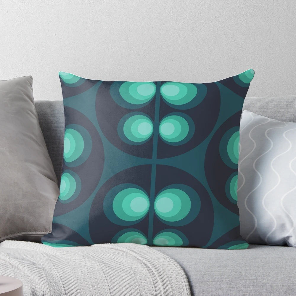 Retro Scandinavian patterned pillow in shades of green, blue, and teal