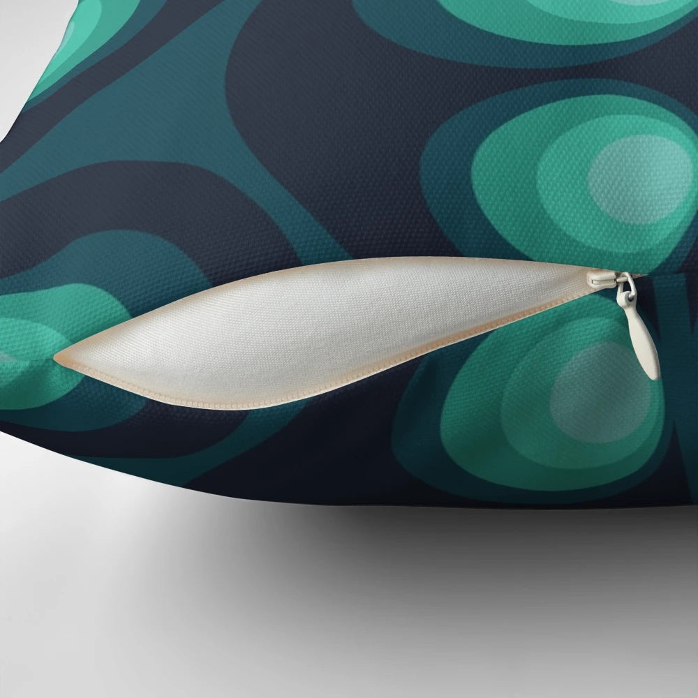 Retro Scandinavian patterned pillow in shades of green, blue, and teal