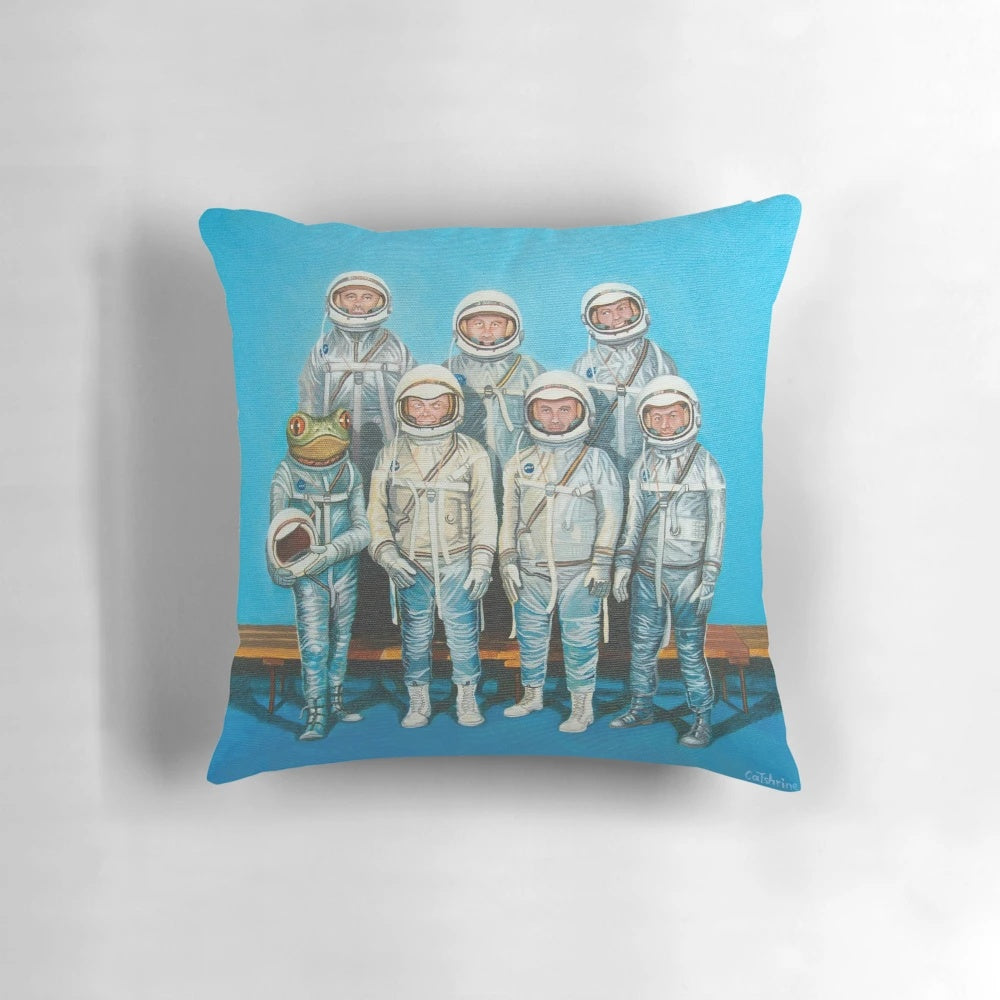 Retro sci-fi inspired pillow featuring a cute, cartoonish astronaut tree frog in a space setting