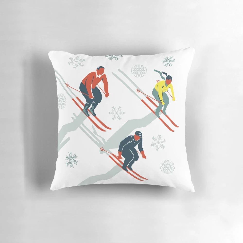 Vibrant mid century modern pillow with retro ski trail graphics in red, teal and yellow