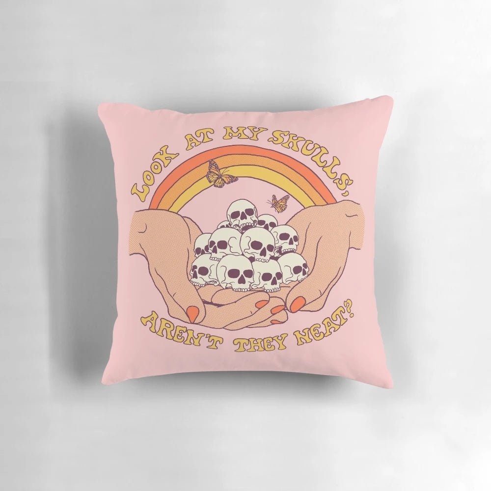 Colorful retro-style skull throw pillow with a pop art design