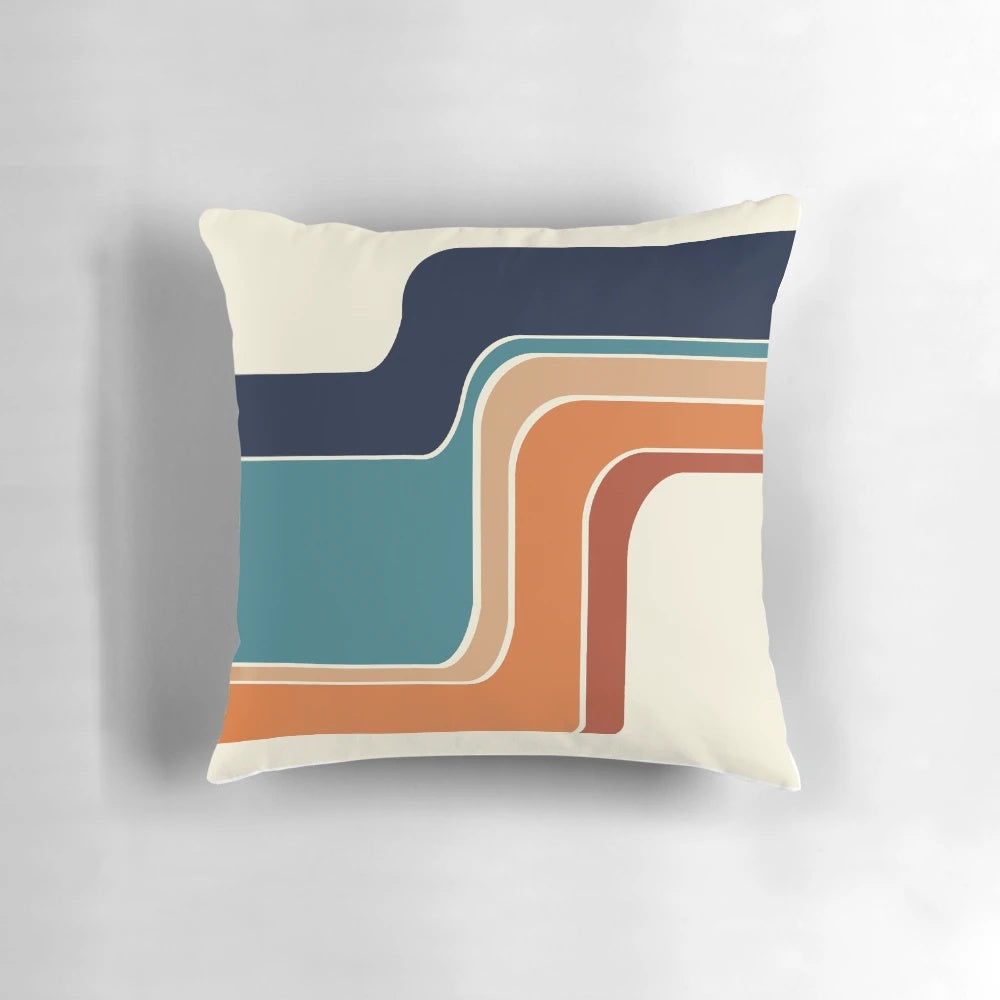 Retro striped pillow in vibrant orange, rust, and blue colors