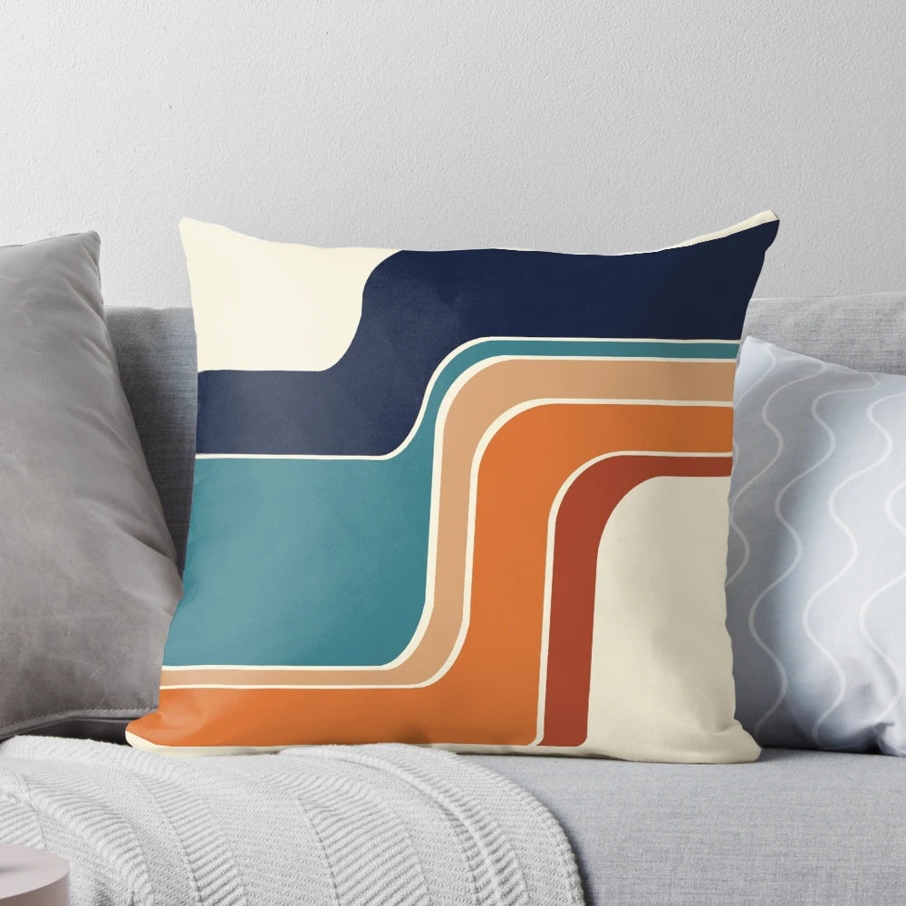 Retro striped pillow in vibrant orange, rust, and blue colors