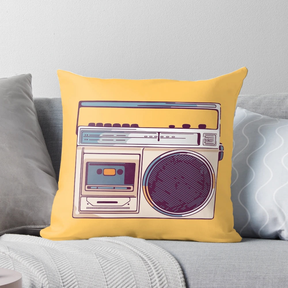 Vibrant yellow pillow with a retro-style boombox graphic, perfect for adding a touch of 80s nostalgia to any room.