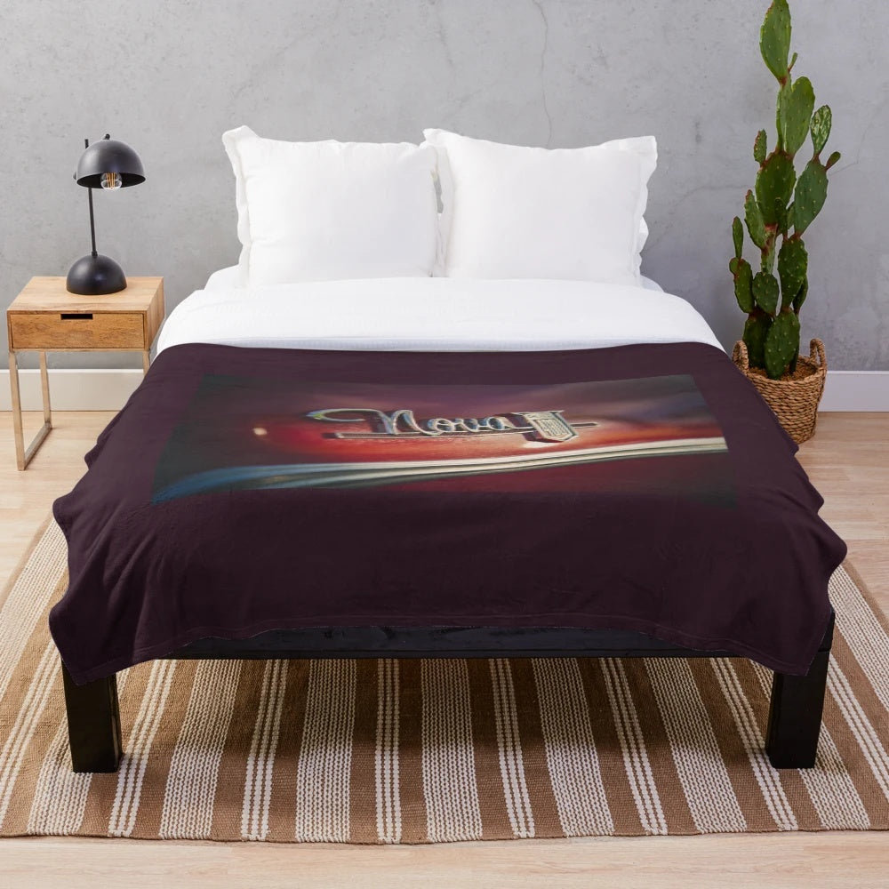 Retro-style plush blanket featuring the iconic Chevy Nova logo