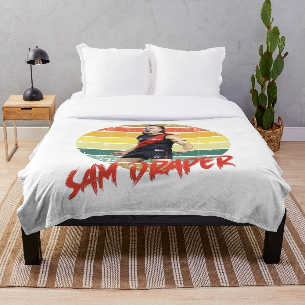 A soft, plush blanket featuring a vintage sun motif design
